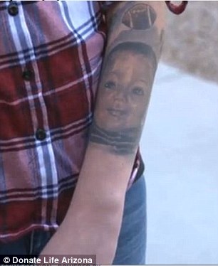 A tattoo of Lukas (pictured) can be seen on Clark